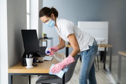 Woman cleaning a desk