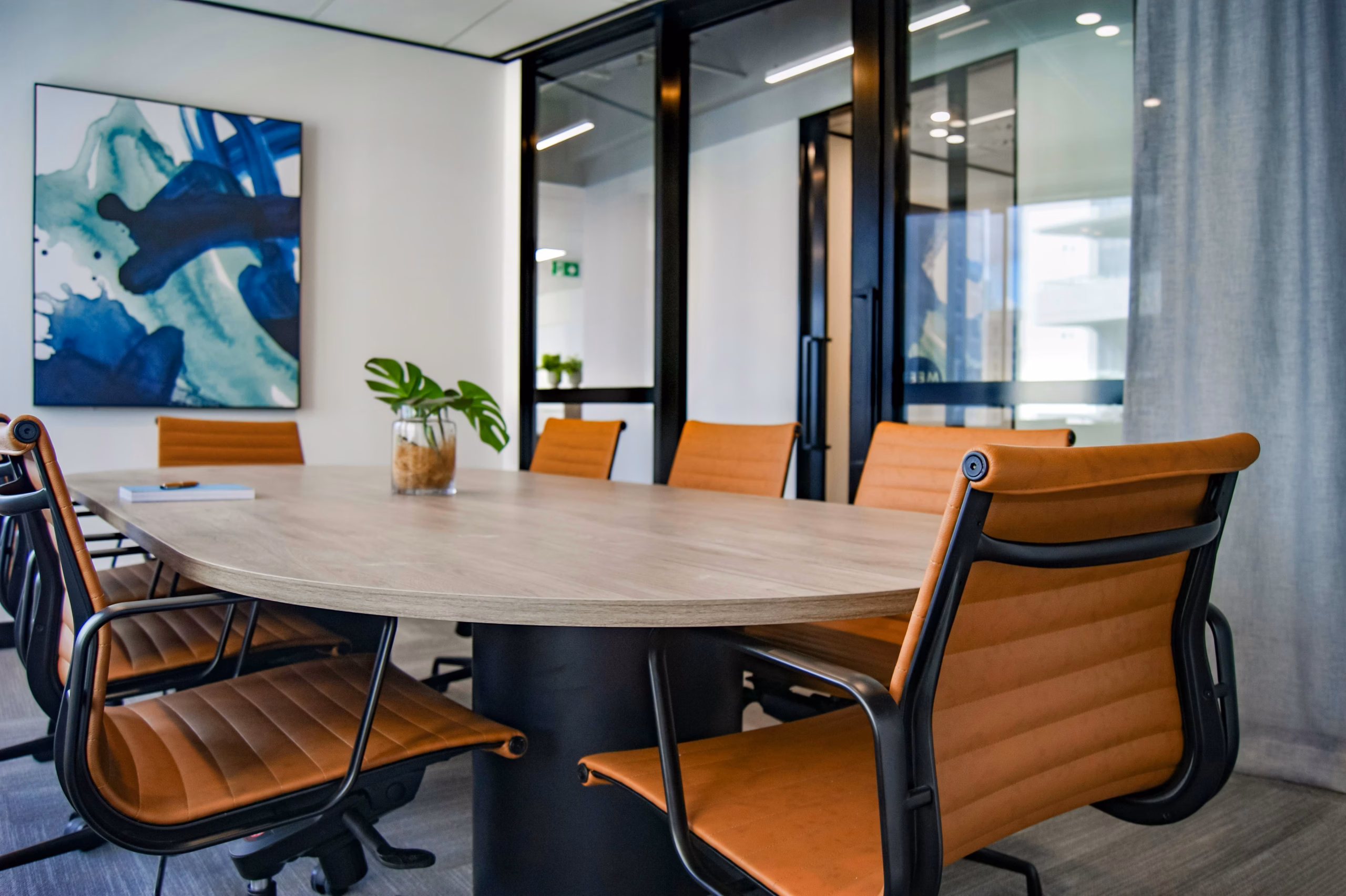 meeting room in office with clean table and orange chairs