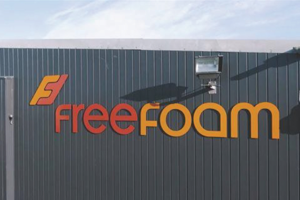 Free Foam logo in two-tone on side of building
