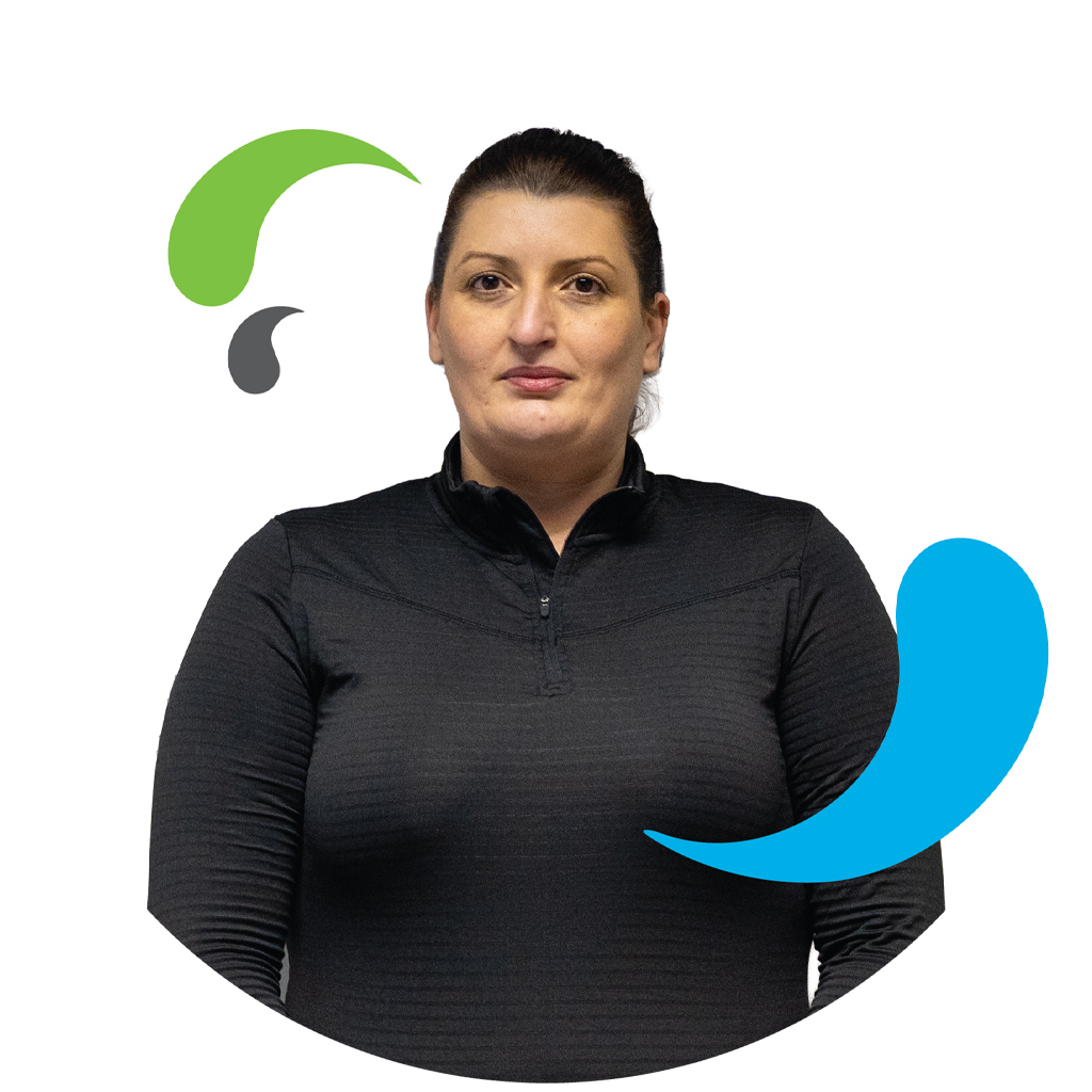 LCS female member of staff headshot with LCS splash elements from logo